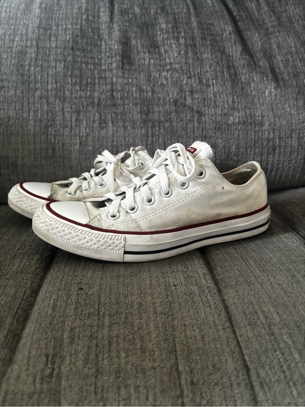White Low-Top Converse Sneakers with Red Accent - Women Size 7; Men Size 5